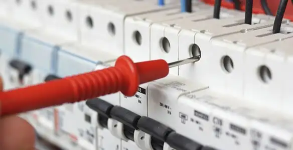 Electrical contractor testing circuit breakers during electrical repair in Hermitage, TN