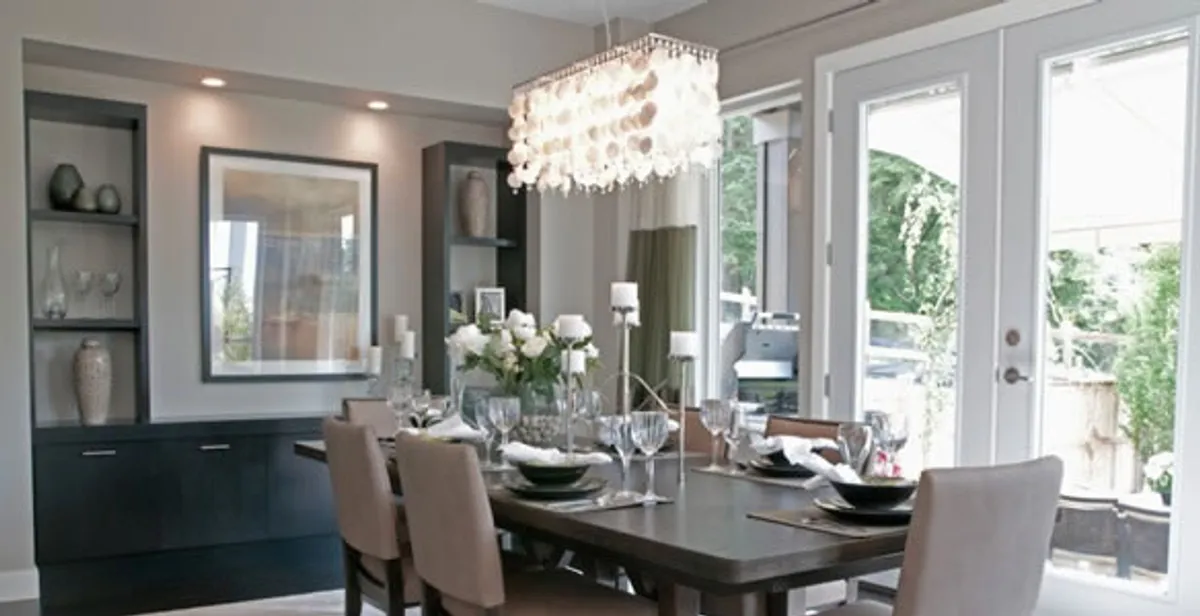 Elegant dining room chandelier installation above table in Nashville, TN
