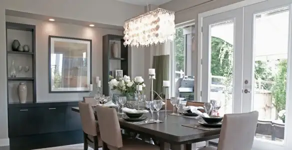 Elegant dining room chandelier installation above table in Nashville, TN