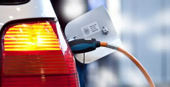 Electric car plugged into EV charger after professional installation in Nashville, TN