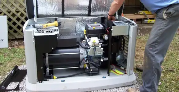 generator installation service showing technician connecting and configuring generator components in Nashville, TN