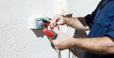 Electrician performing home electrical outlet and wiring inspection in Nashville, TN