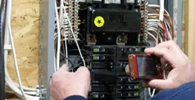 Home electrical inspection of circuit breaker panel by licensed electrician in Nashville, TN