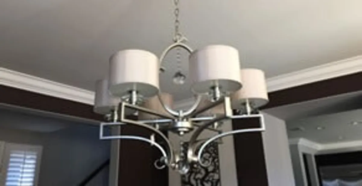 Modern chandelier installation with multiple light fixtures in Nashville, TN
