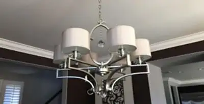 Modern chandelier installation with multiple light fixtures in Nashville, TN