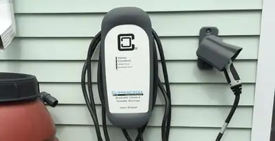 Outdoor electric vehicle charger installation on residential wall in Nashville, TN