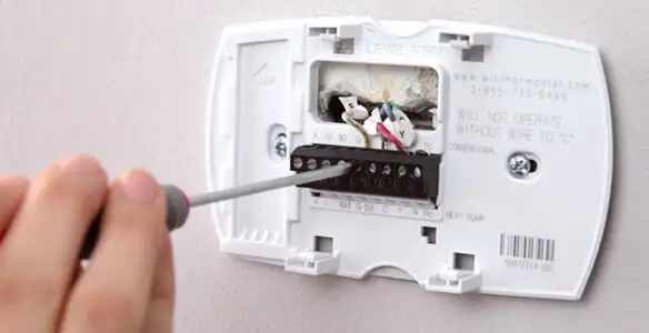 Thermostat installation service with proper wiring and secure wall mounting in Nashville, TN
