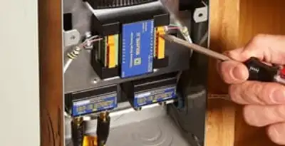 Whole home surge protection device being installed by a licensed electrician to protect electrical systems in Nashville, TN